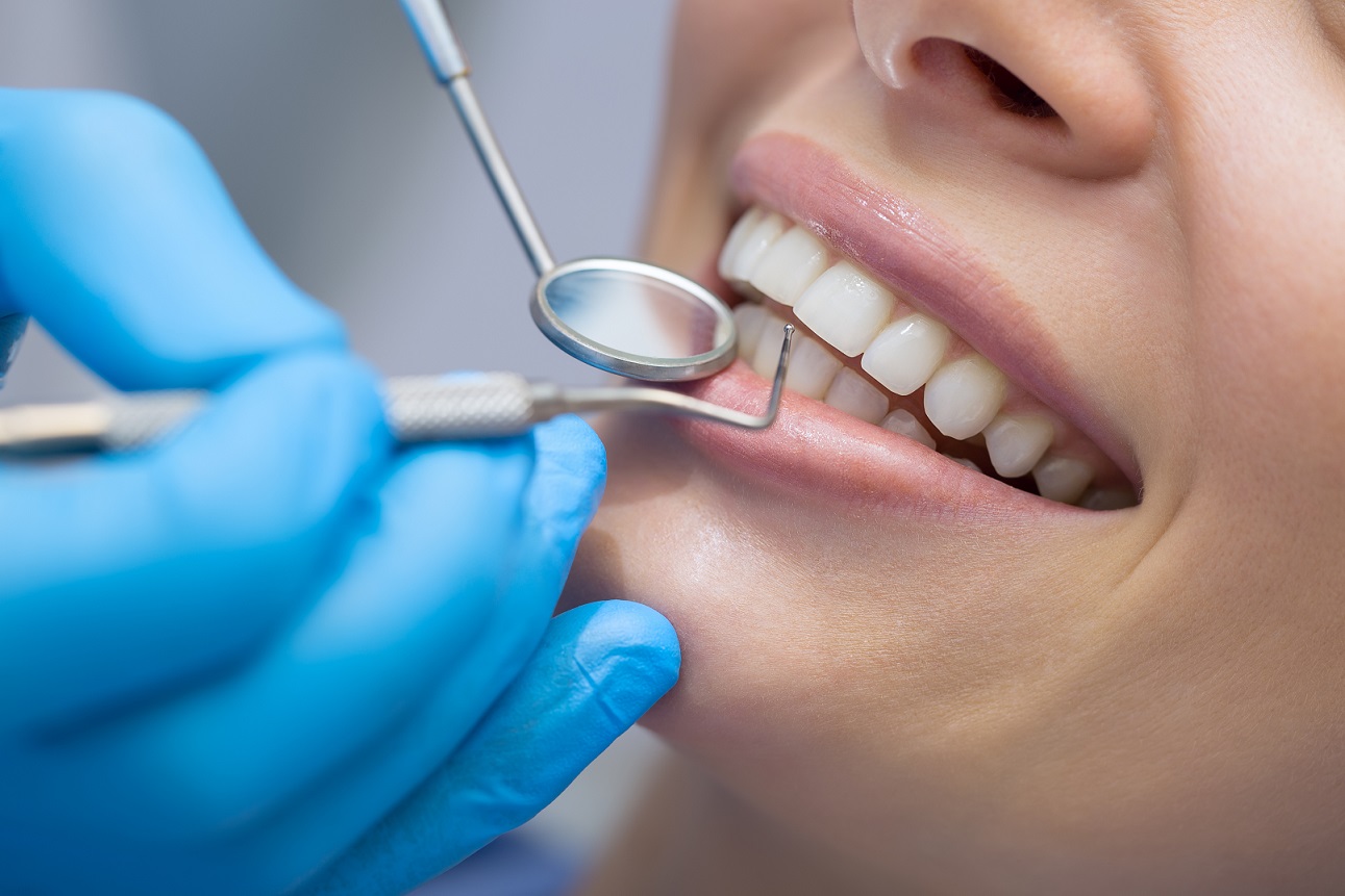 Dental exam with mirror and probe