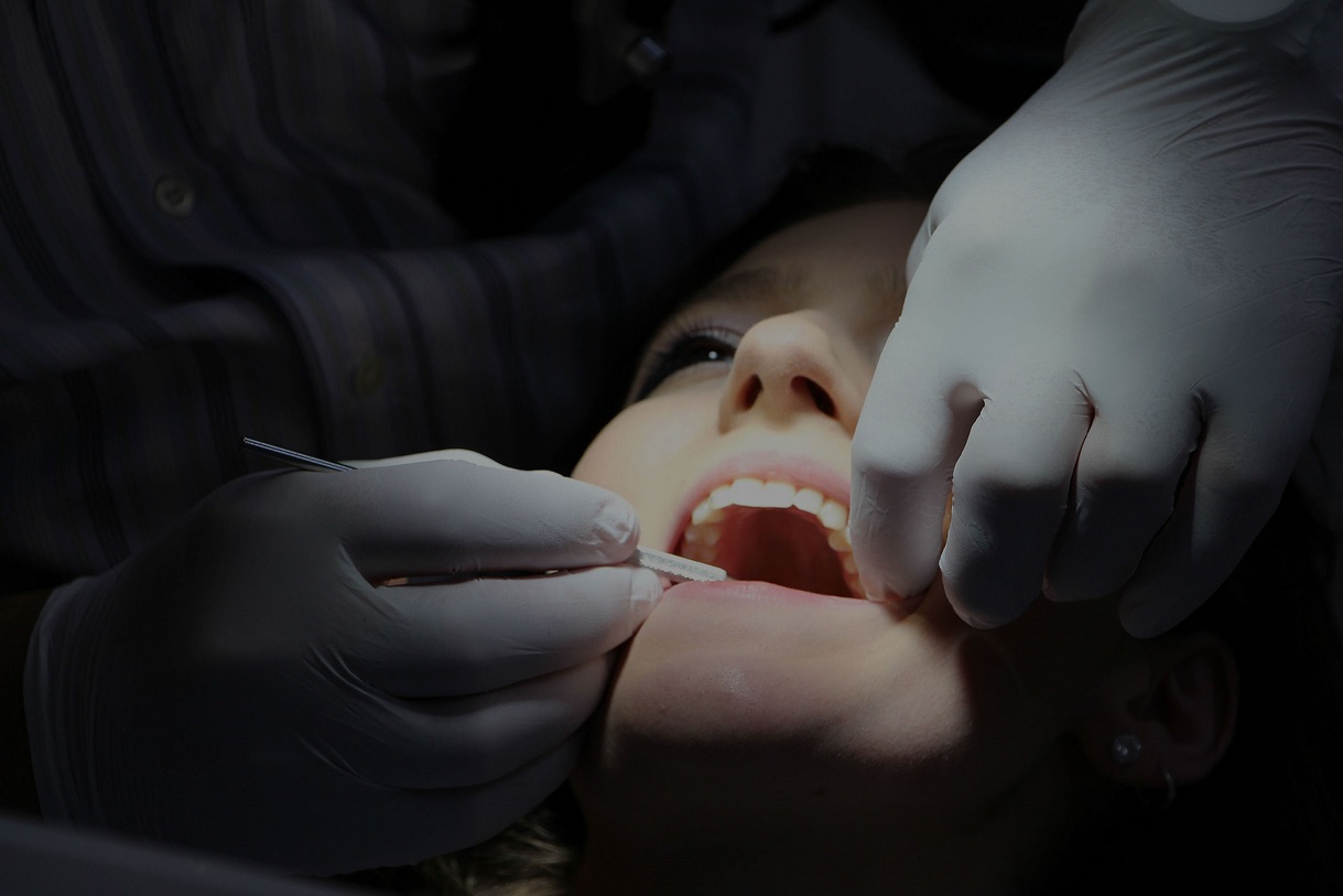 Dentist treating an adult patient in Tijuana