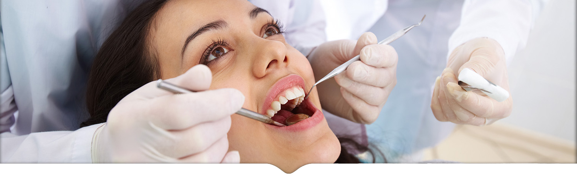 Dental implant patient checking insurance coverage